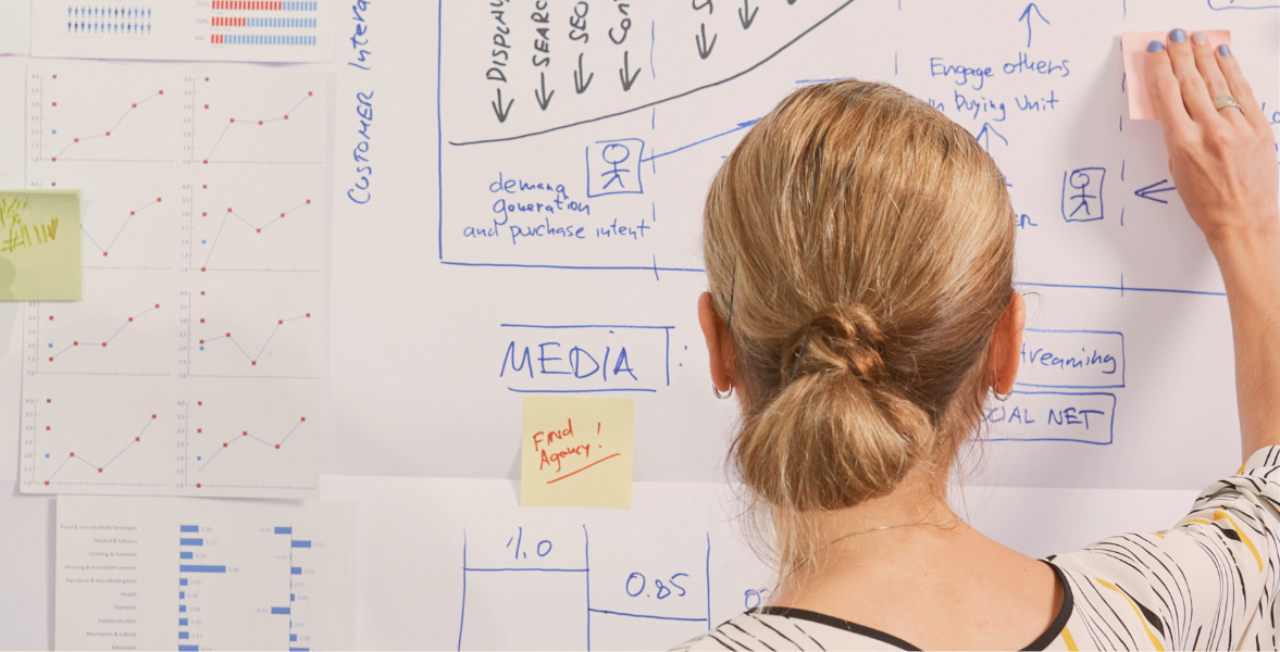 two-people-planning-their-marketing-on-a-flipchart